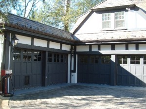 Above, the two car garage is turned perpendicular to the street, leaving the second garage doors to the front the street. A courtyard space inside the driveway area softens the entry experience. 