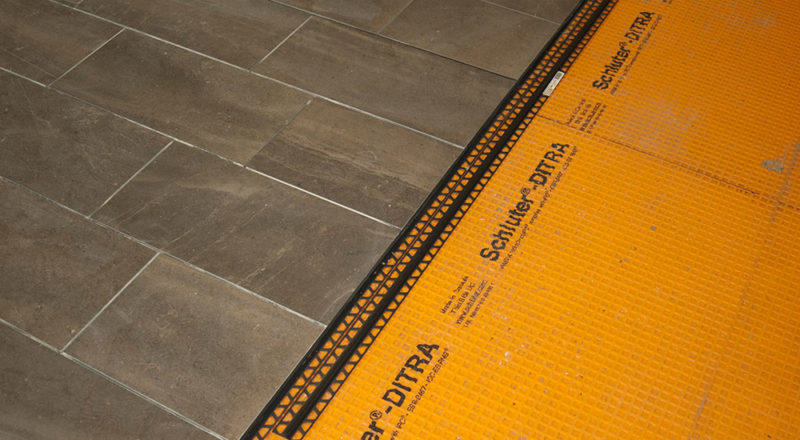 How To Ensure Your Tiled Garage Floor Can Last a Lifetime - VAULT Custom  Garage Design